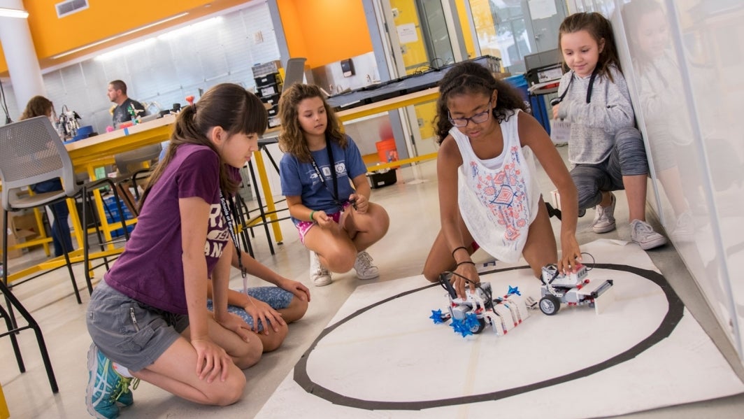 Girls participate in a FIRST LEGO League summer camp.