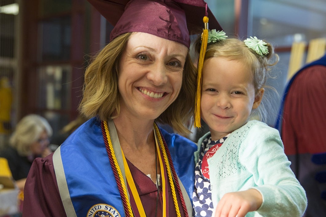 grad holding daughter