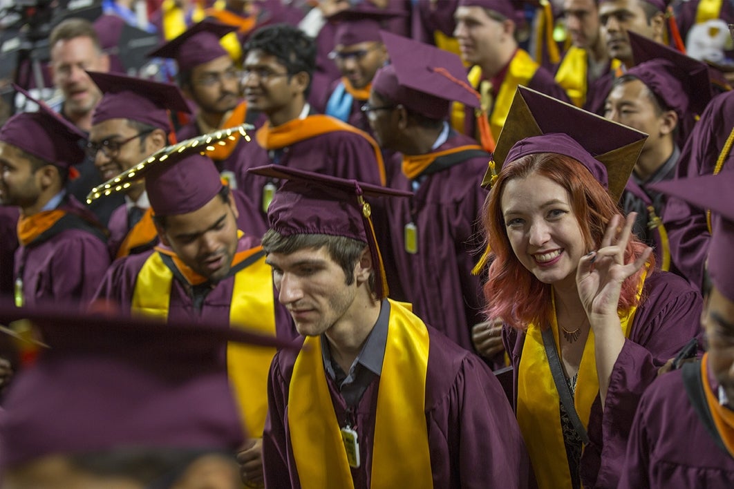 students walking out of graduation