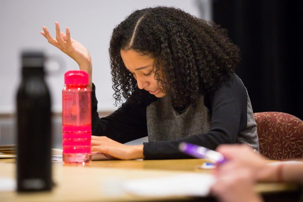 Student actors rehearse a play.