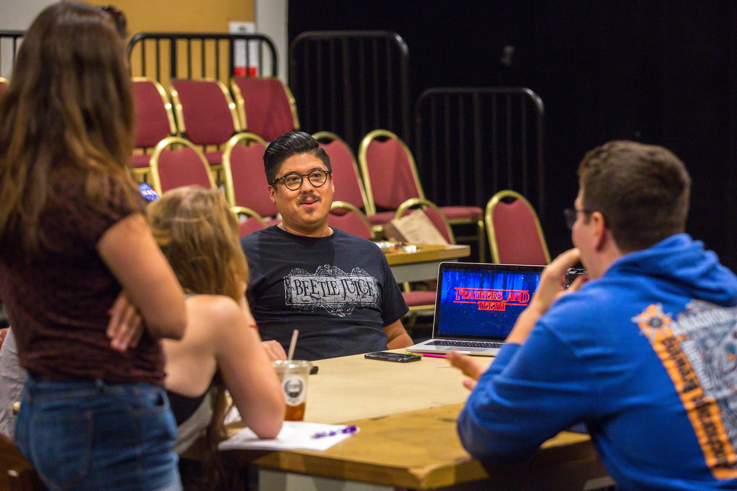 Student actors rehearse a play.