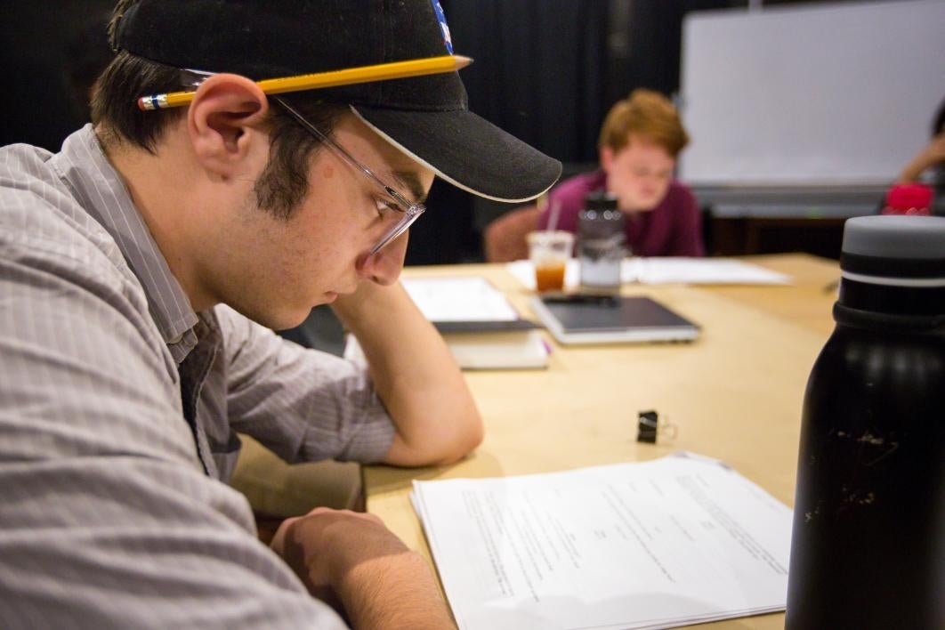 Student actors rehearse a play.