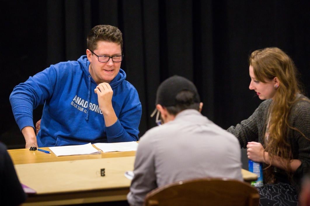 Student actors rehearse a play.