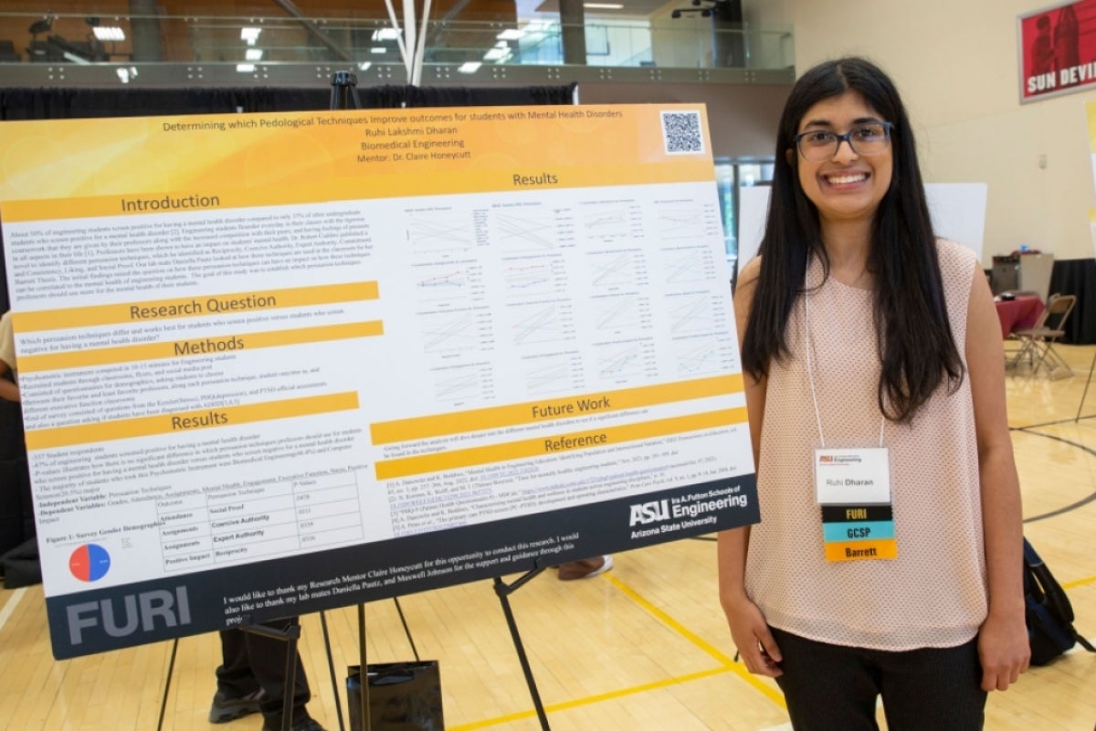 ASU biomedical engineering undergraduate student Ruhi Dharan poses with a research poster presenting her Fulton Undergraduate Research Initiative project findings.