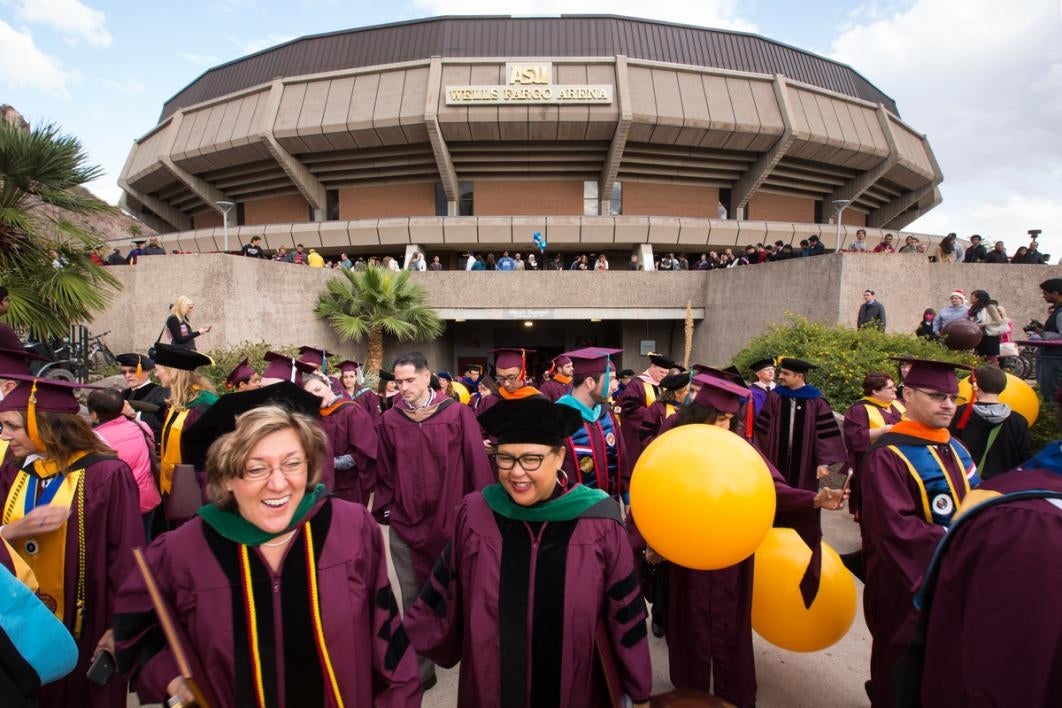 People leave a graduation ceremony.