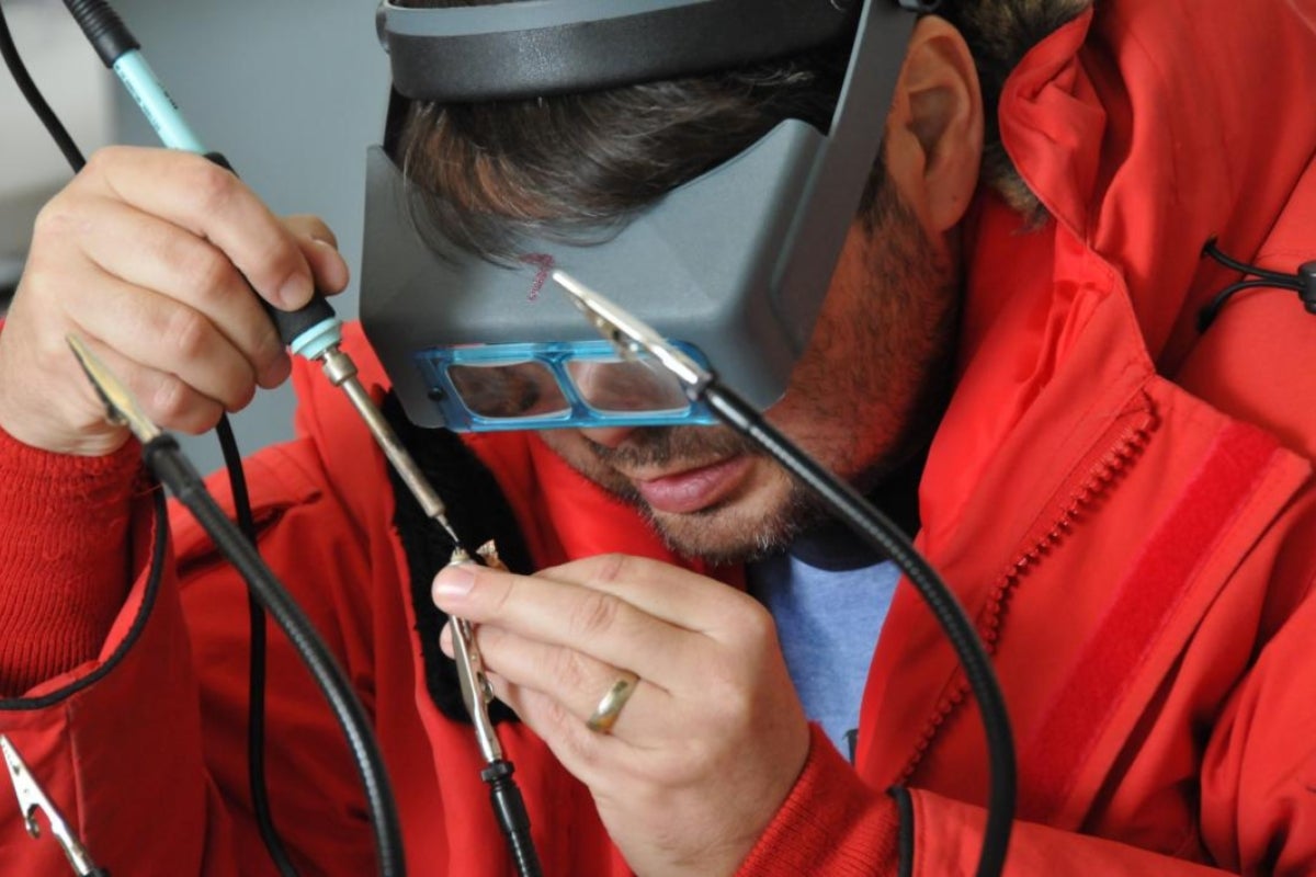 man working on electrical connector