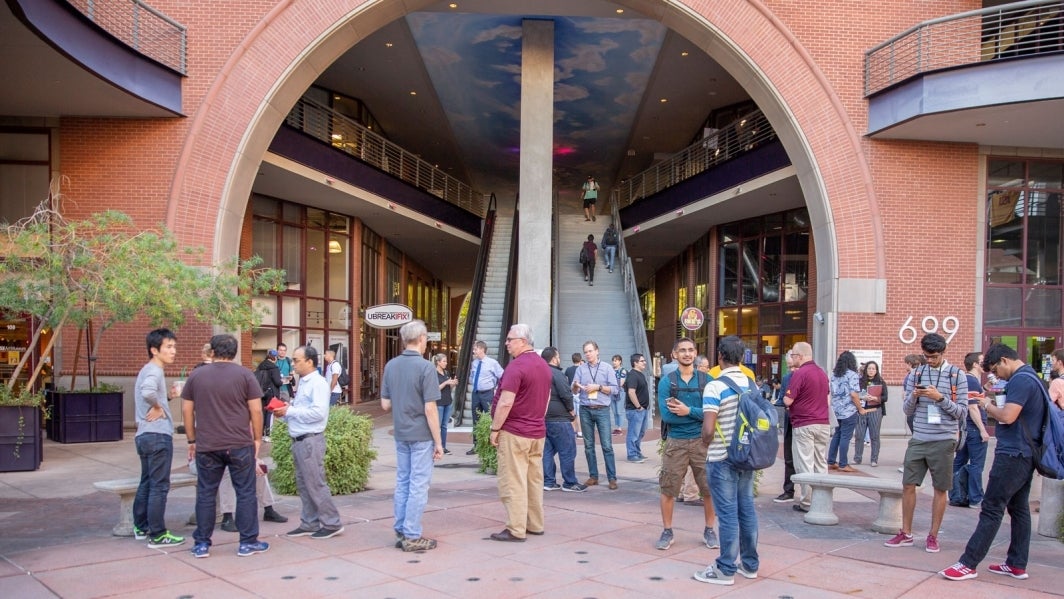 A group of people outside the Brickyard building on the ASU Tempe campus.