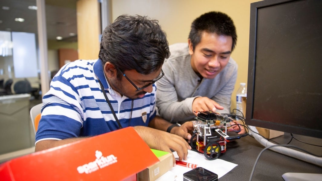 Students work on a robot.