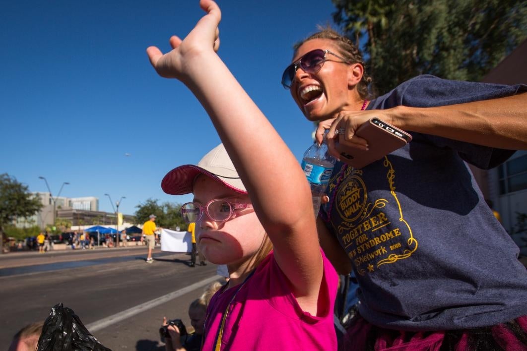 People cheer during the ASU Homecoming Parade