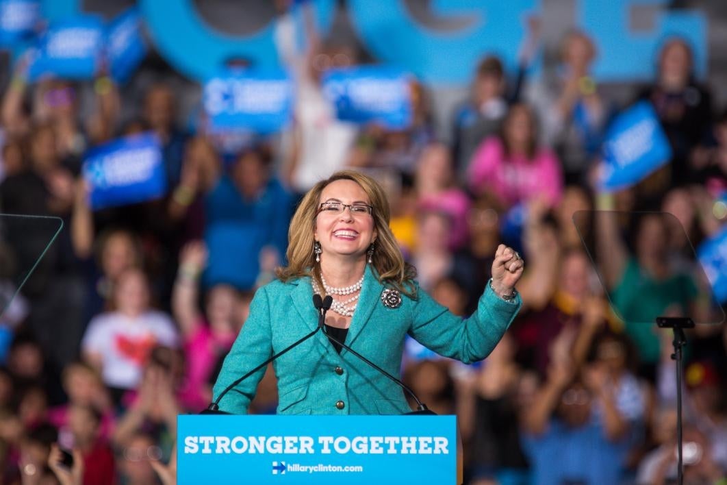 woman speaking at podium