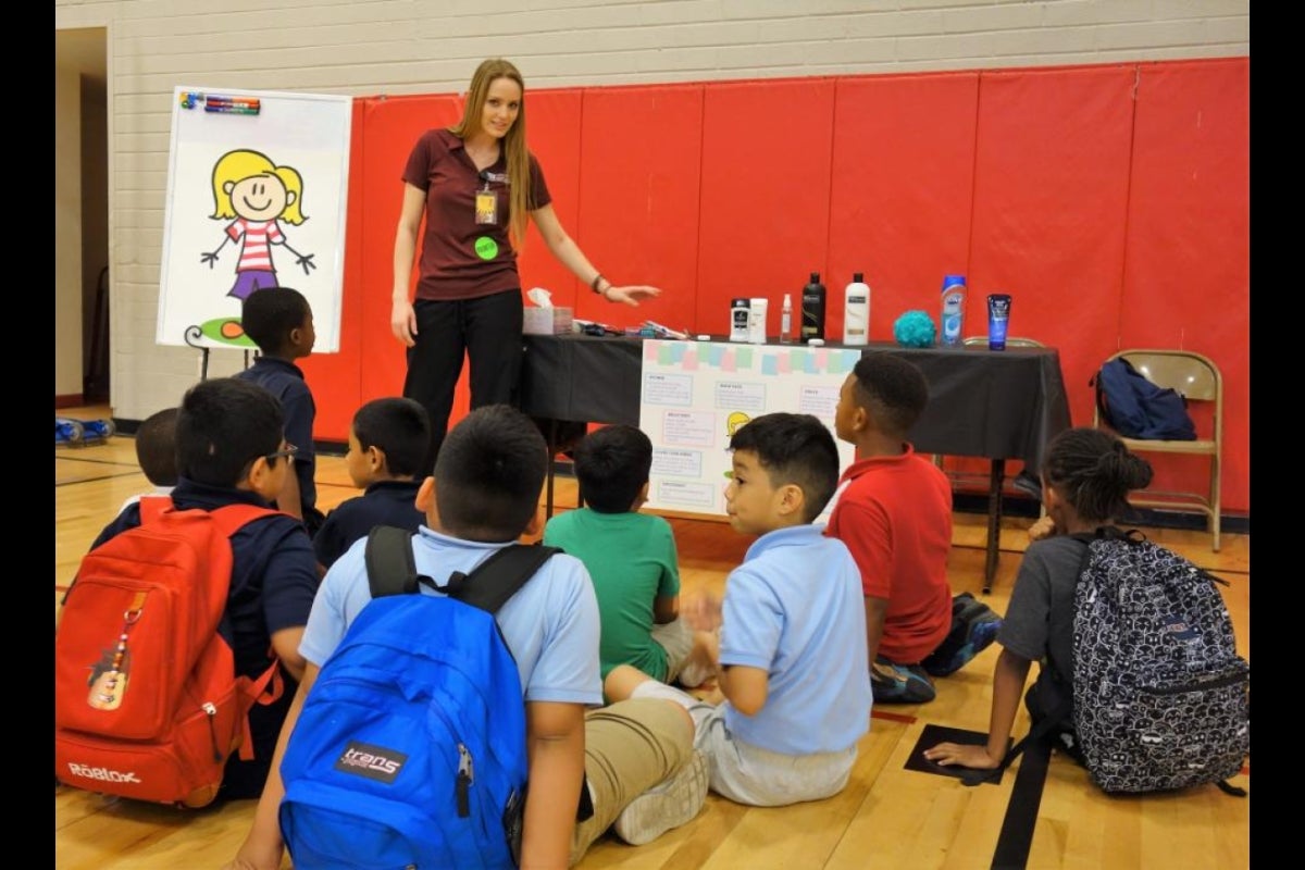 ASU nursing student talks about hygiene with health fair participants