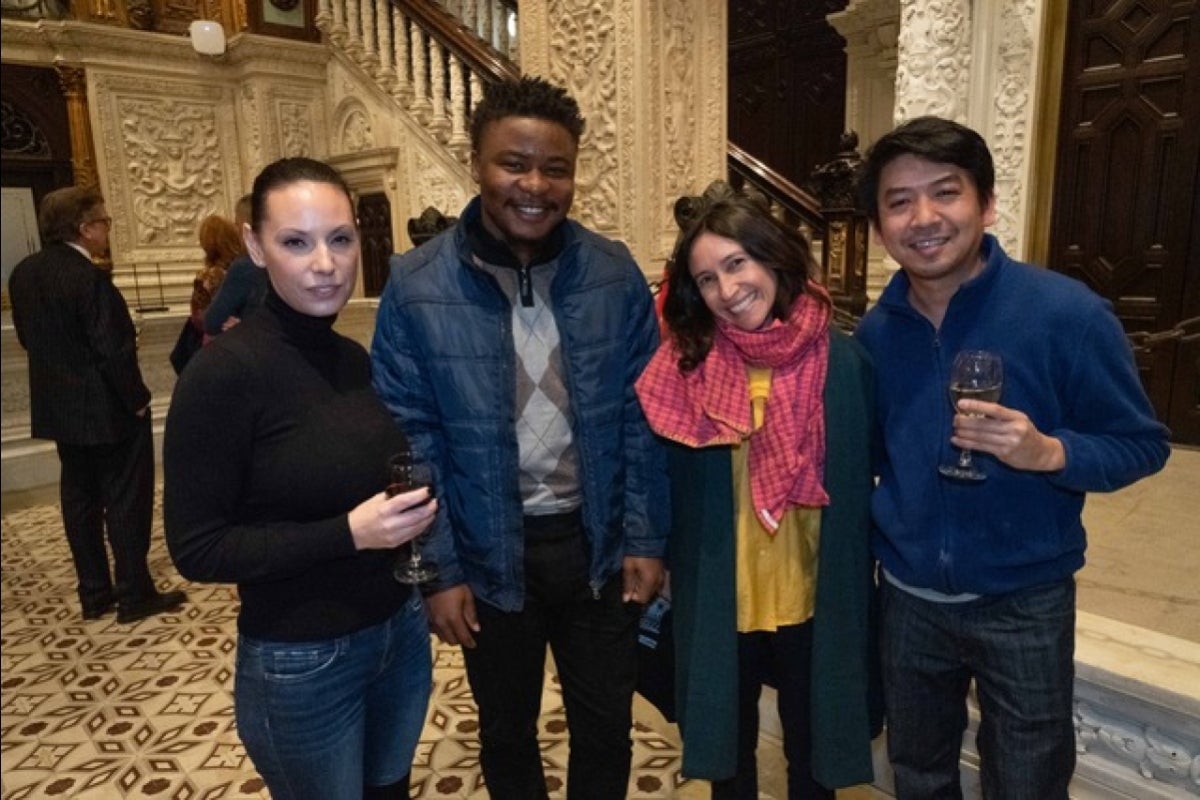 ASU students smiling for a group photo at a media event.