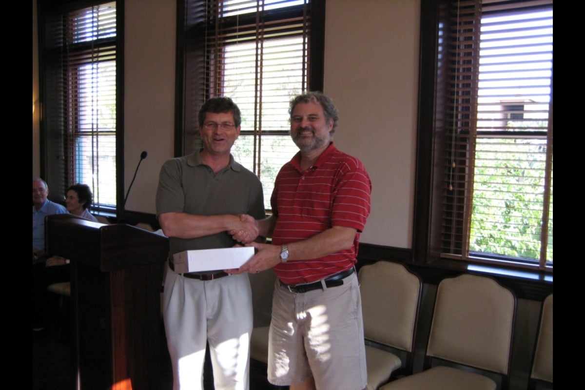 Two men shaking hands.