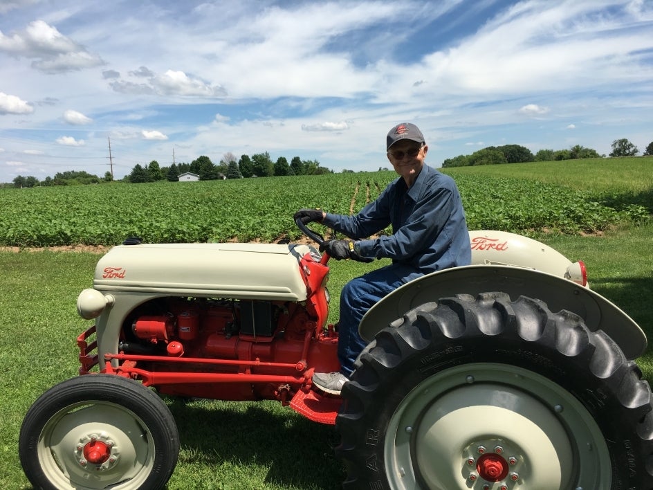 Duane rides the tractor