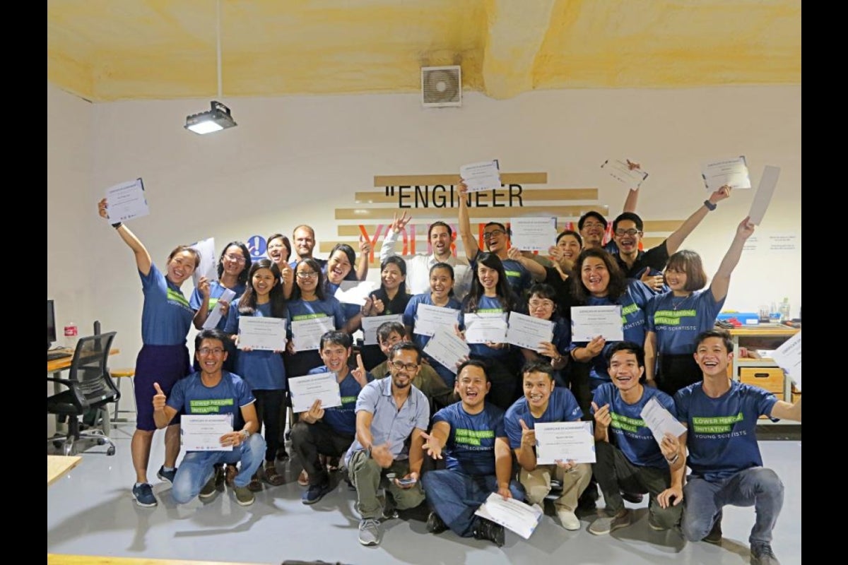 large group of students holding certificates