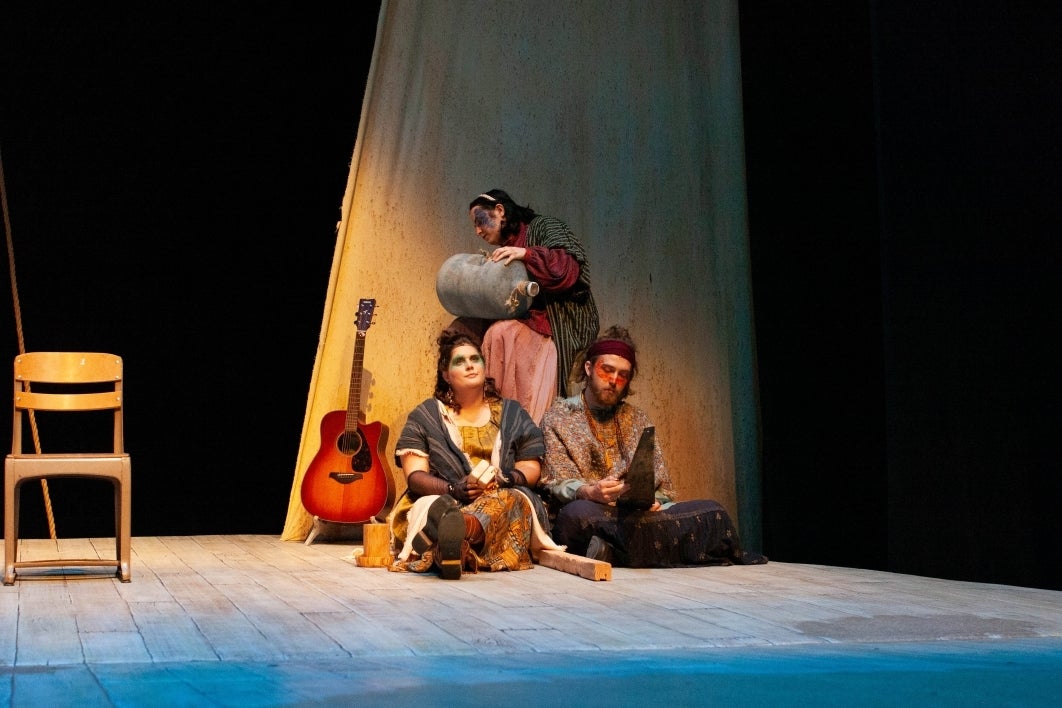 Actors on stage during a play.