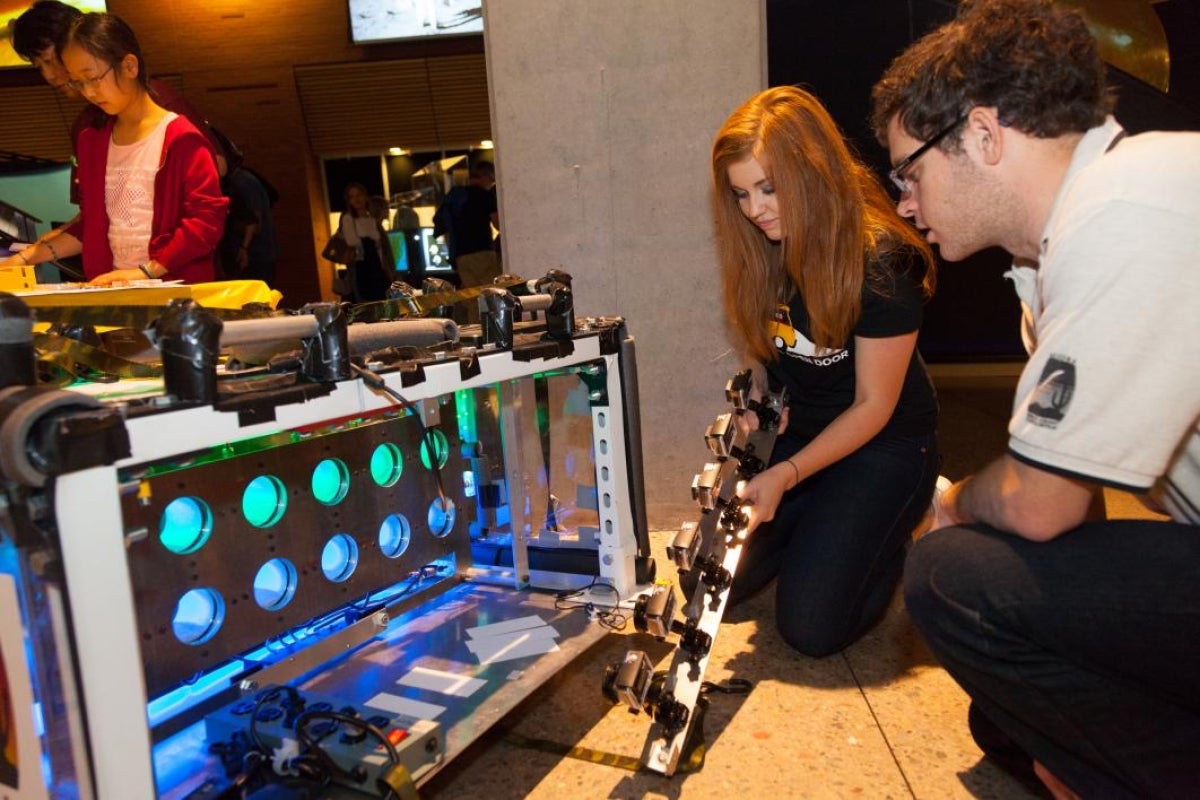 ASU student sharing research project with visitor in the School of Earth and Space Exploration