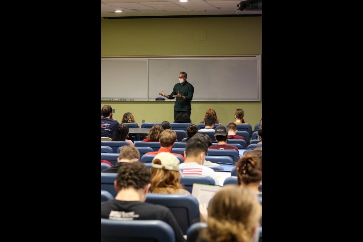 Bassam Youssef speaking with ASU political science studens