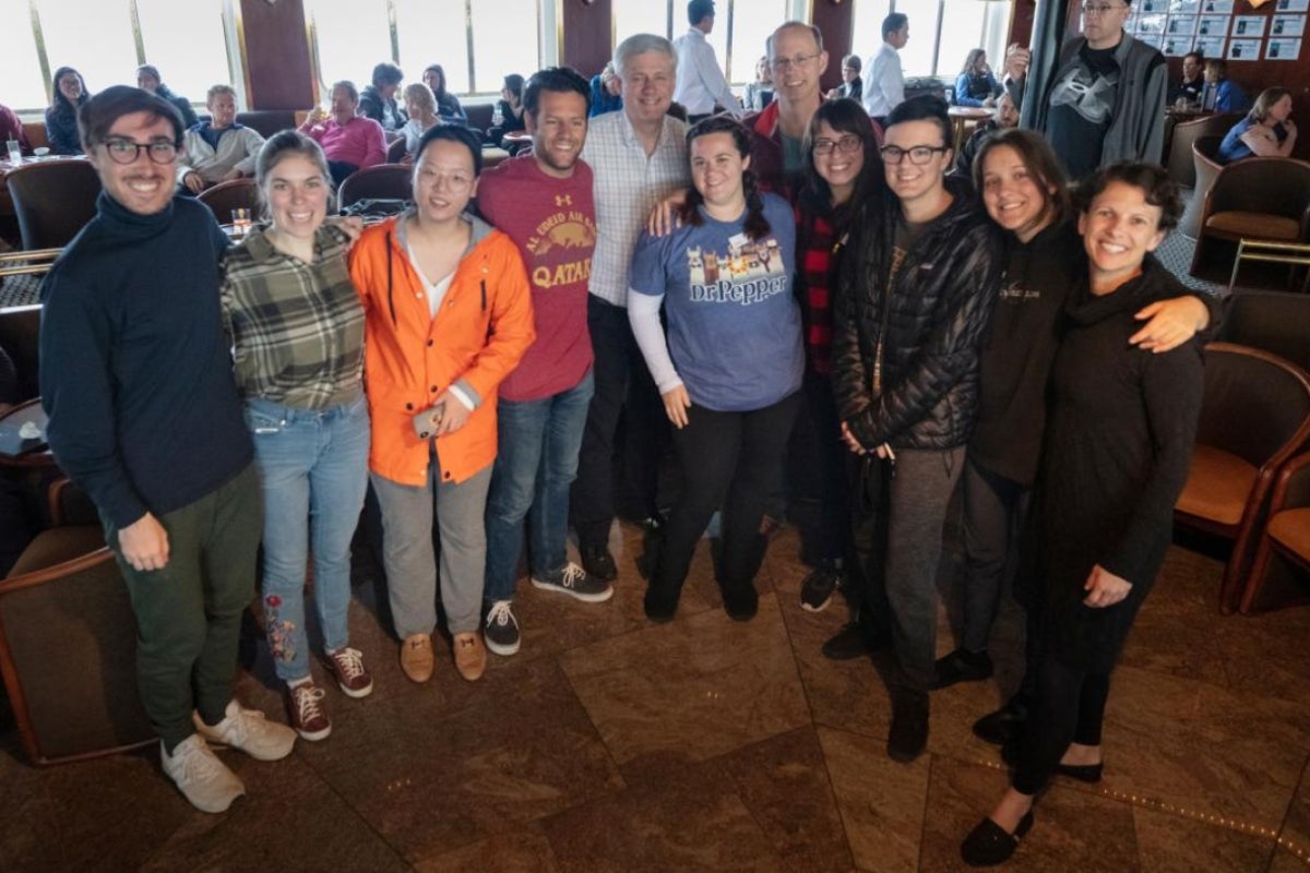 Group of ASU students pictured with former prime minister of Canada aboard a ship in Antarctica