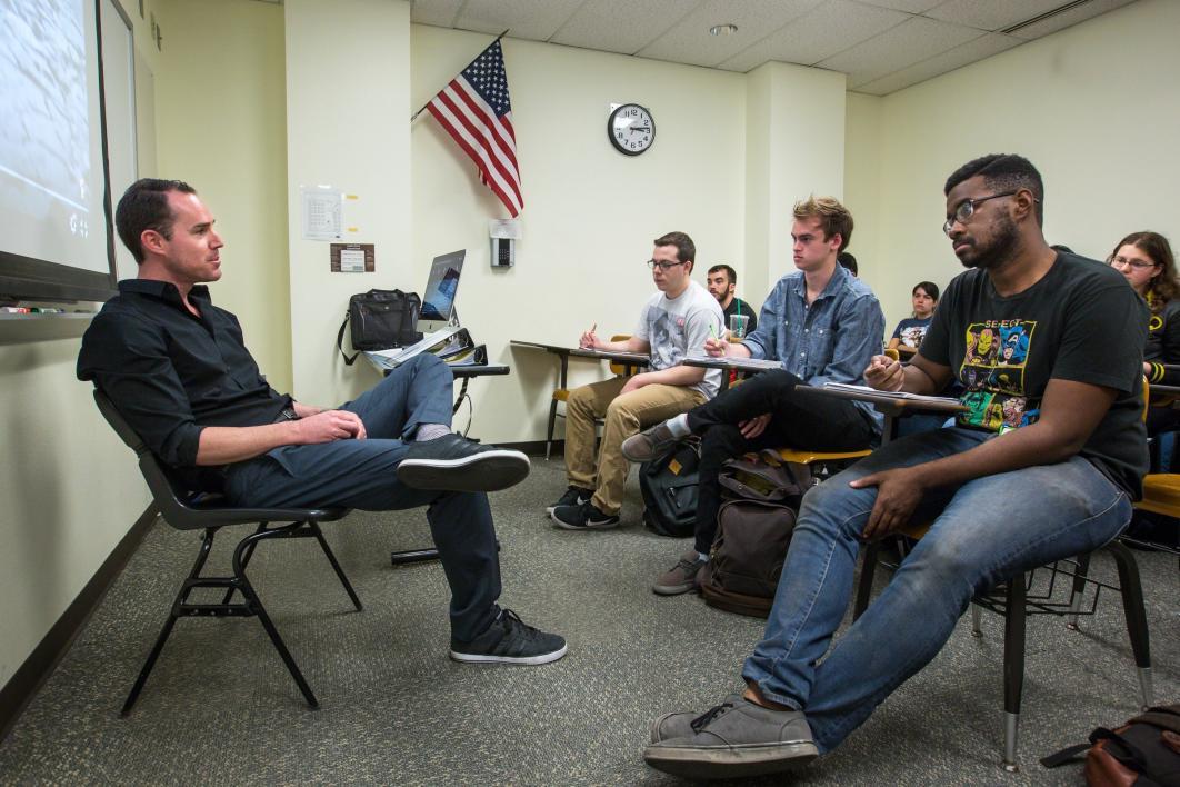 man teaching class