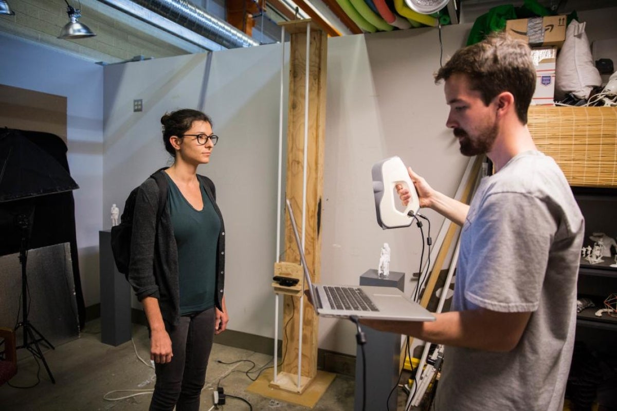 Andrew Noble scans fellow graduate student Kim Lyle