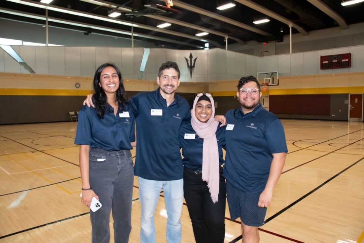 Students pose for a group photo at Foundations, Thunderbird's New Student Orientation event.