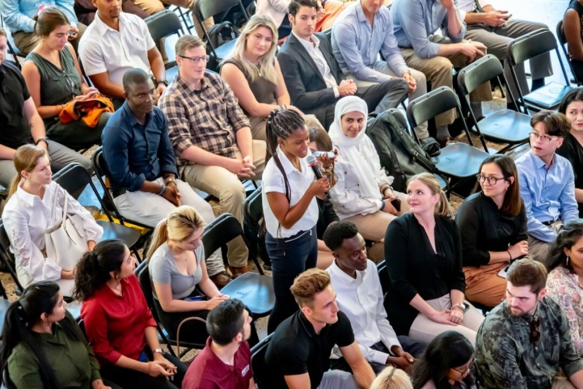 Group of students seated in an auditorium at Foundations, Thunderbird's new student orientation event.