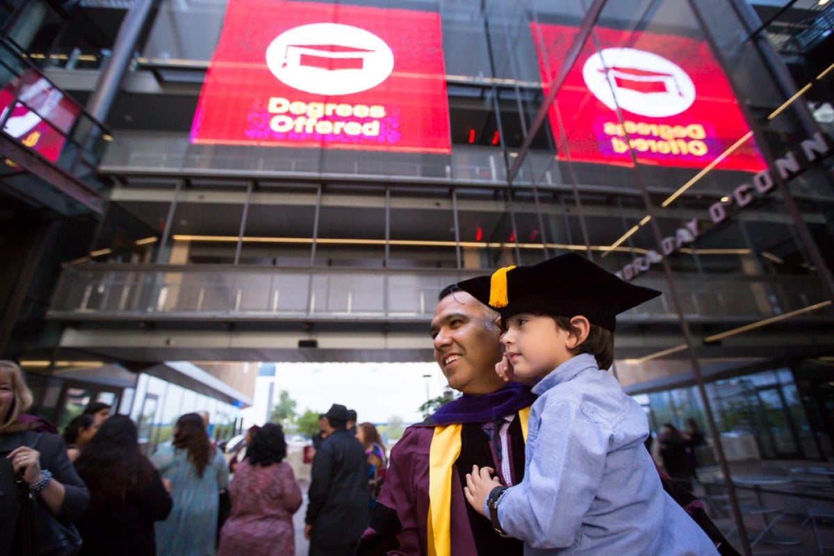 Three-year-old helps dad celebrate