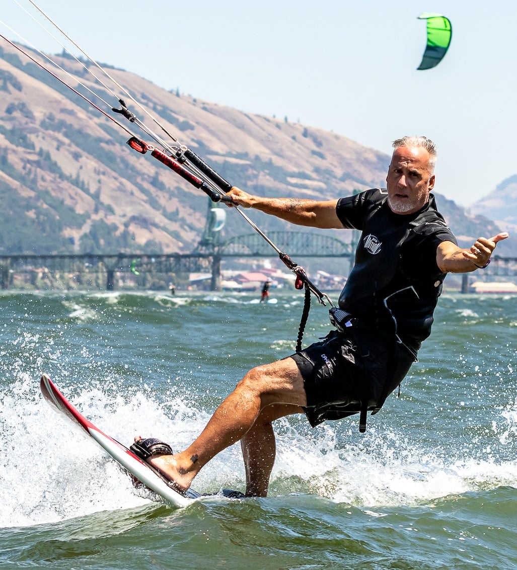 Man windsurfing on the ocean.