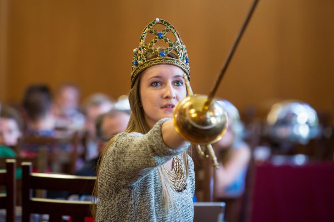 A student acts in a scene at the Chaucer Celebration.