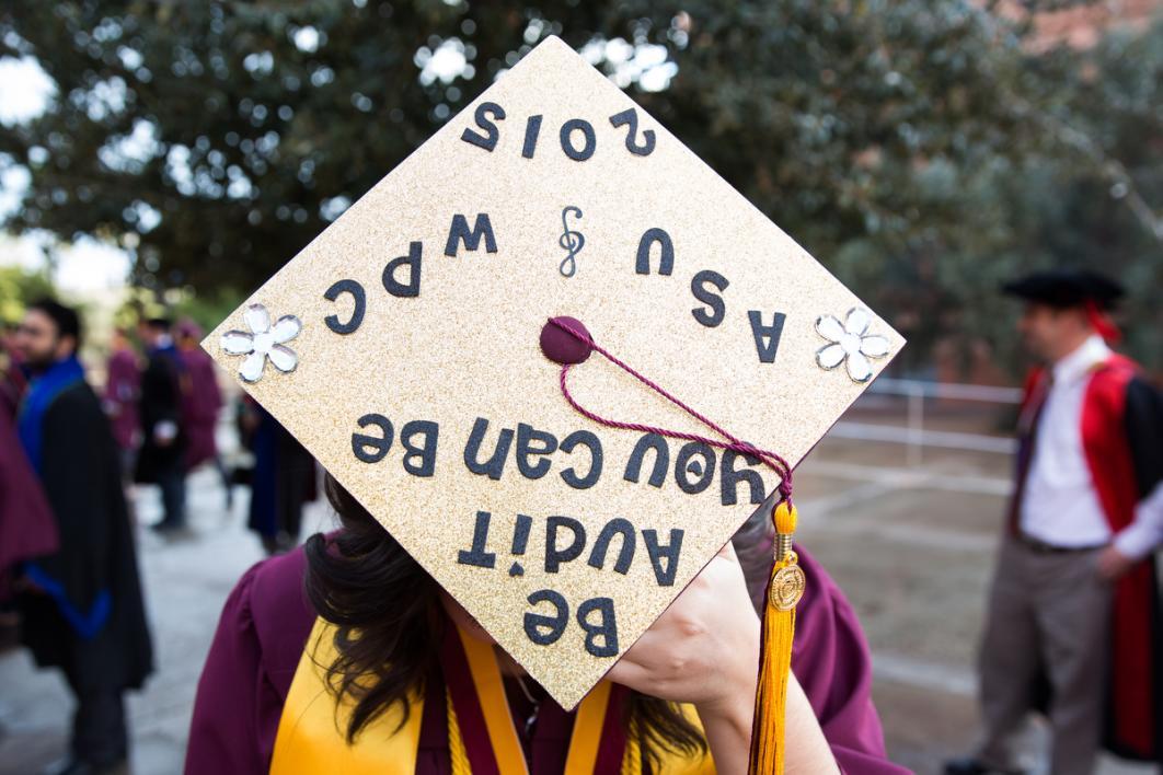 A graduation cap reads, 