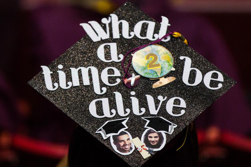 A graduation caps says 