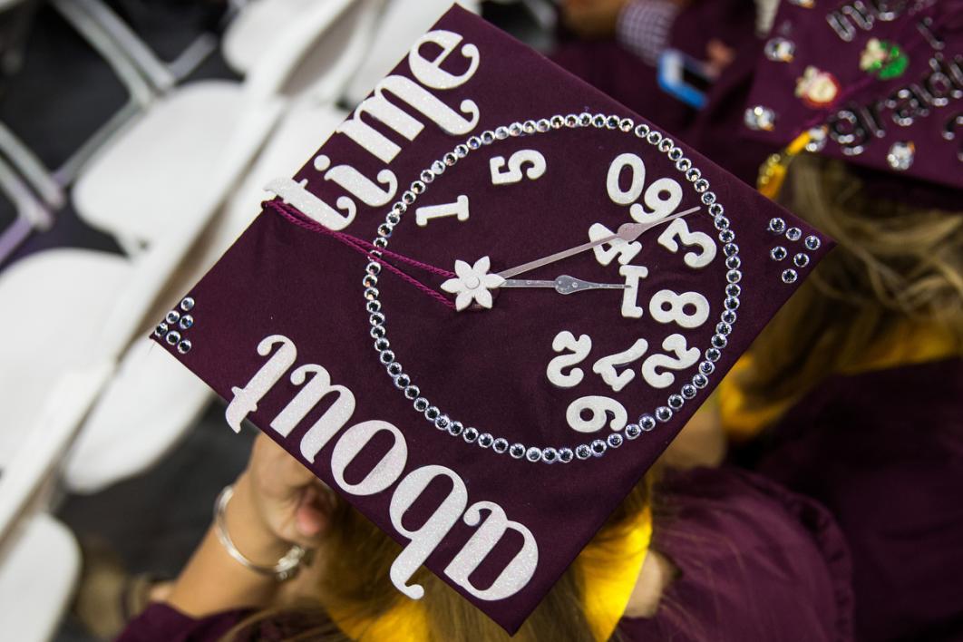 A graduation cap says, 