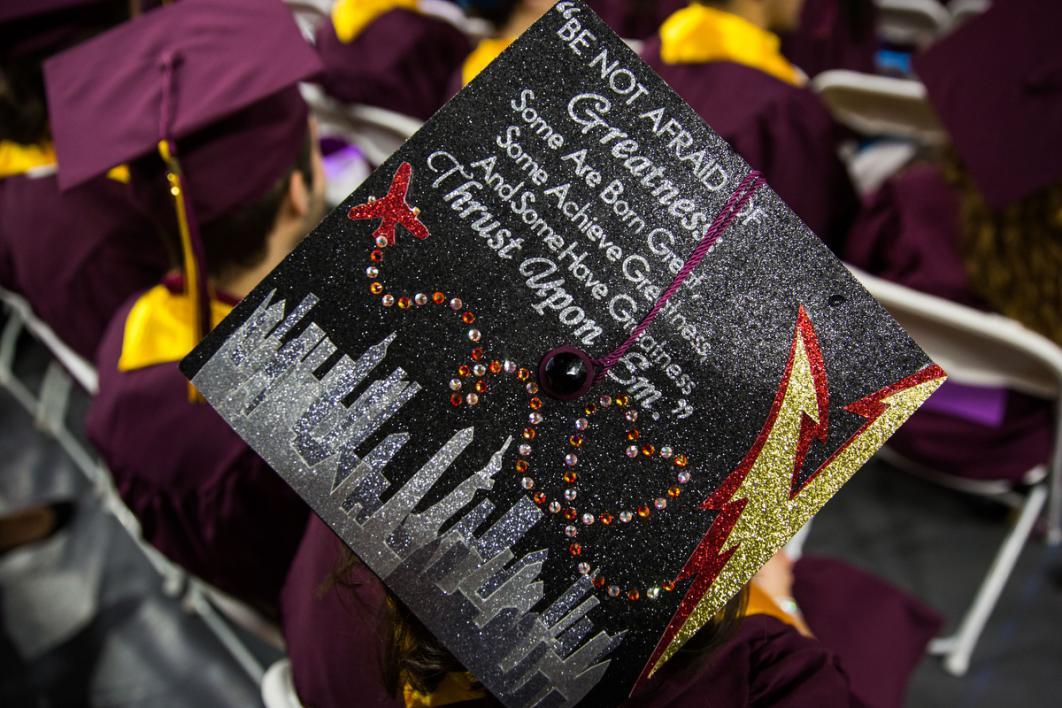 A graduation cap reads, 