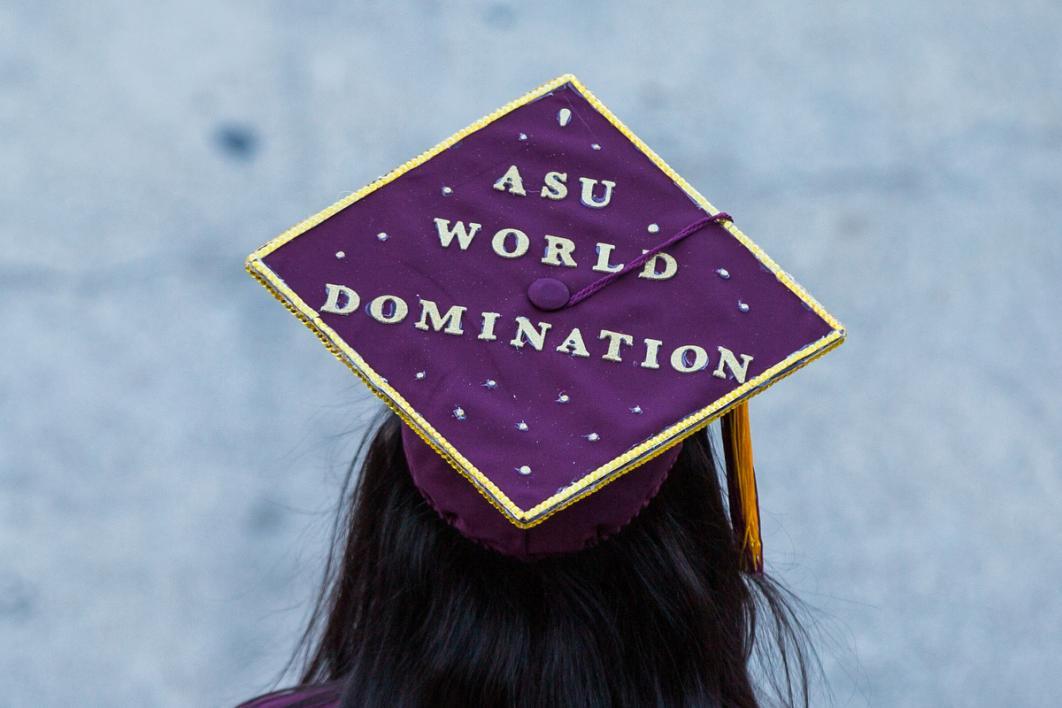 A graduation cap reads, 