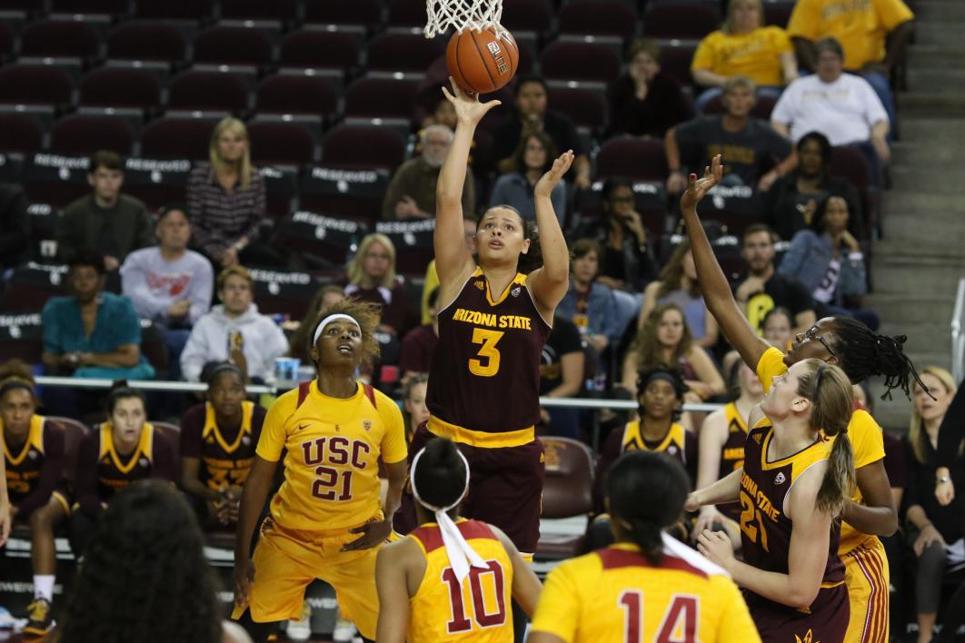 Women playing basketball.