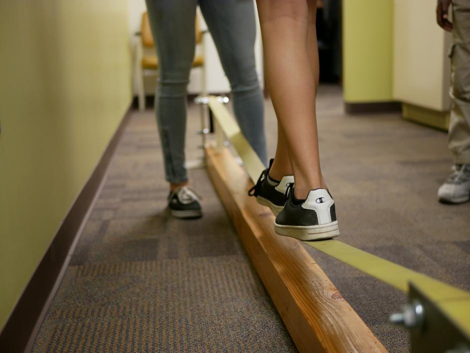 Student balancing on slackline