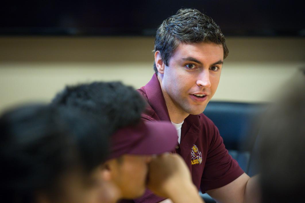 man speaking to students