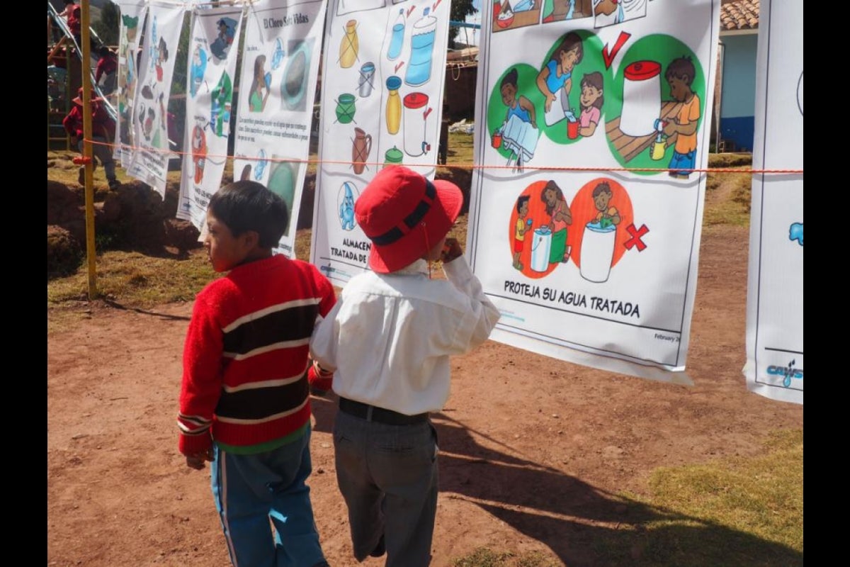 Kids learn about water sanitation and hygiene during Peru's launch day educational seminar.