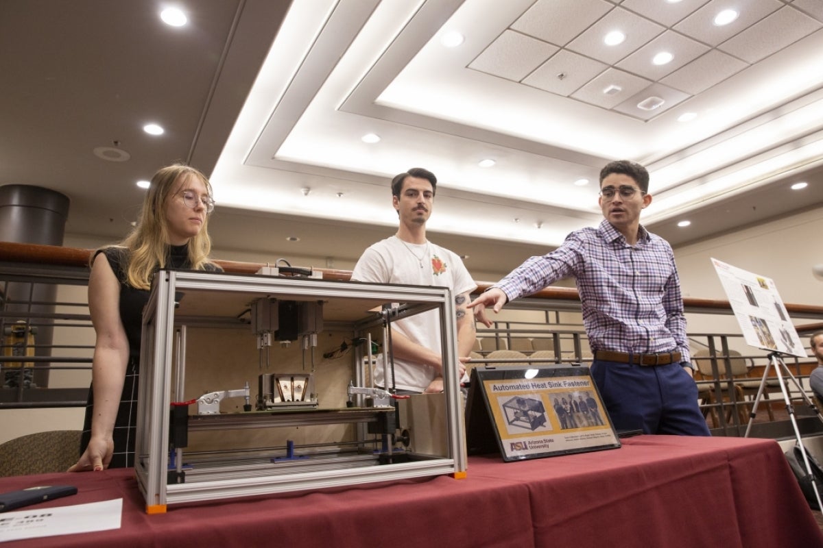 Students pose by their prototype