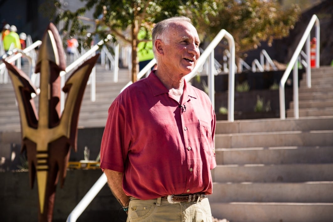 ASU alum Art Pearce standing outside Sun Devil Stadium