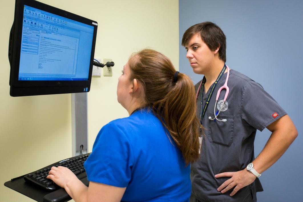 two people looking at computer in exam room