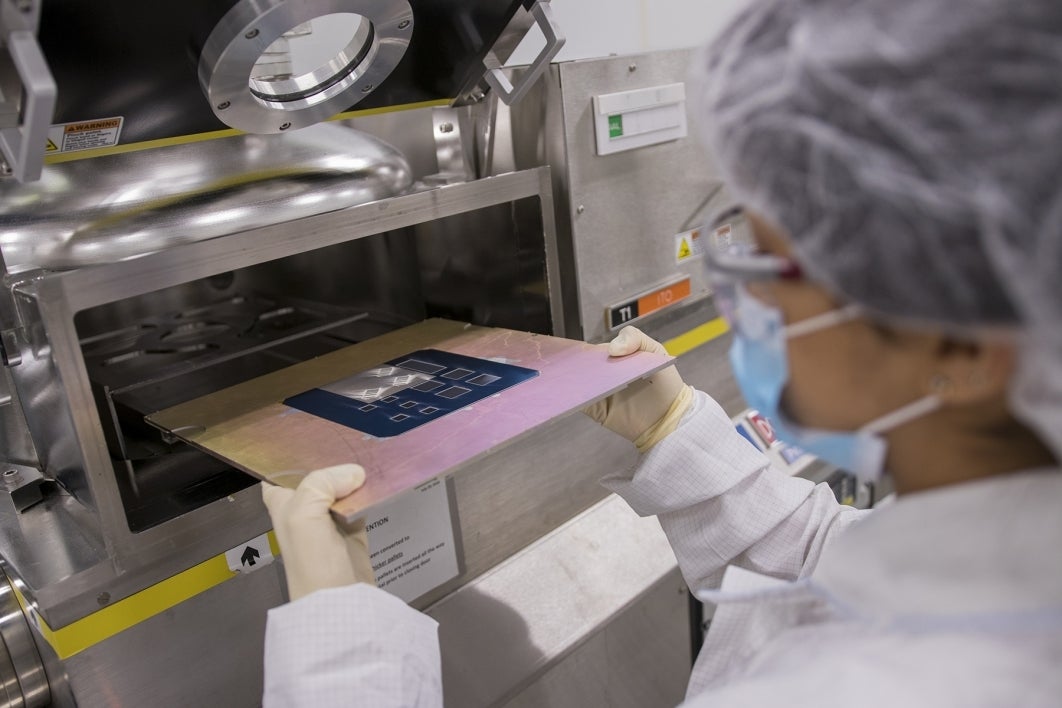 scientists conducting photovoltaic research at ASU's QESST lab