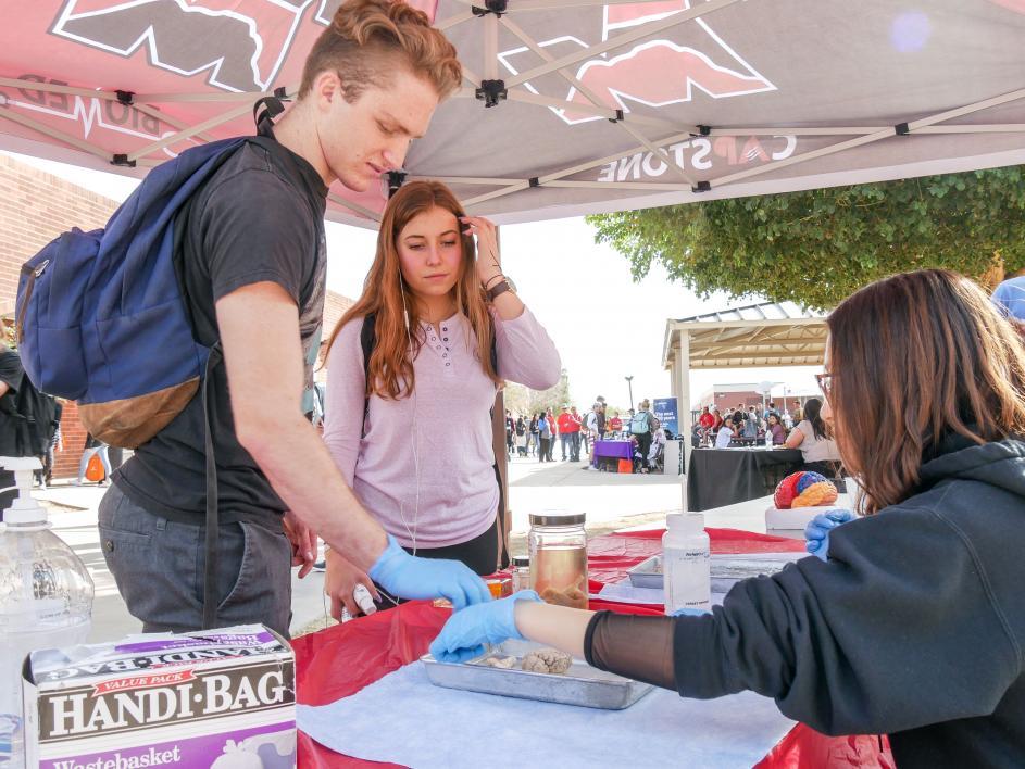 Maria Valenzuela-Sanchez helps fellow Red Mountain High School students at STEM day