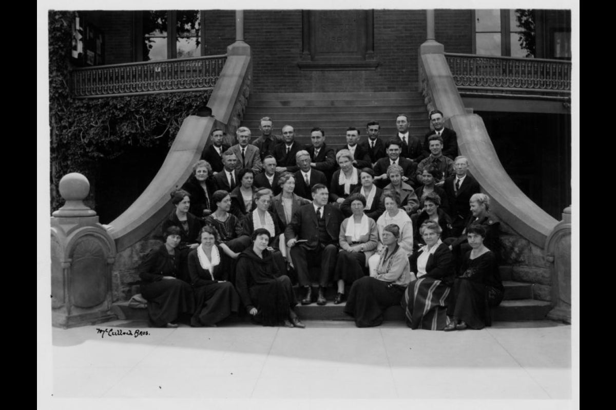 Principal Matthews and staff on the steps of old main