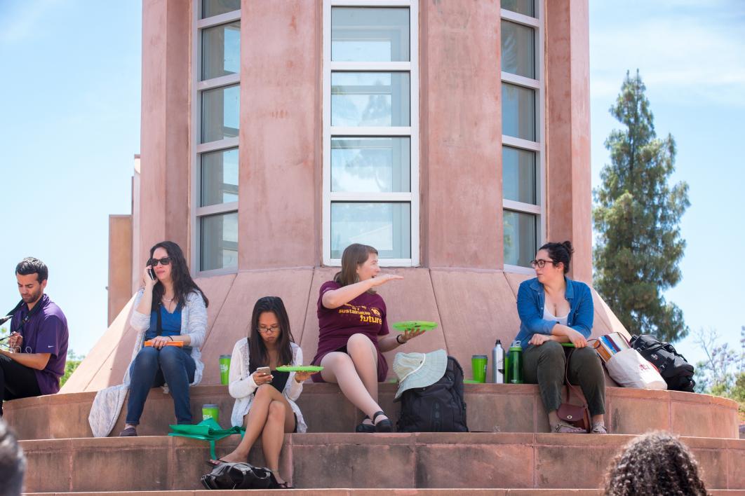 People sitting on Hayden Lawn steps eating food