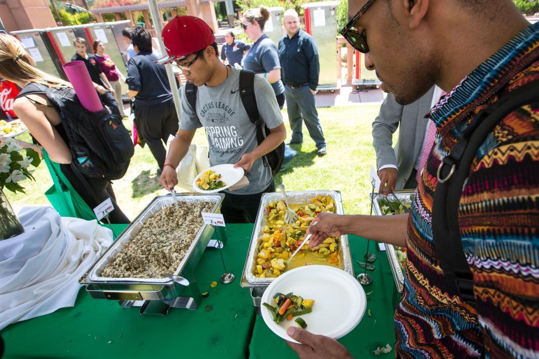 people serving themselves food