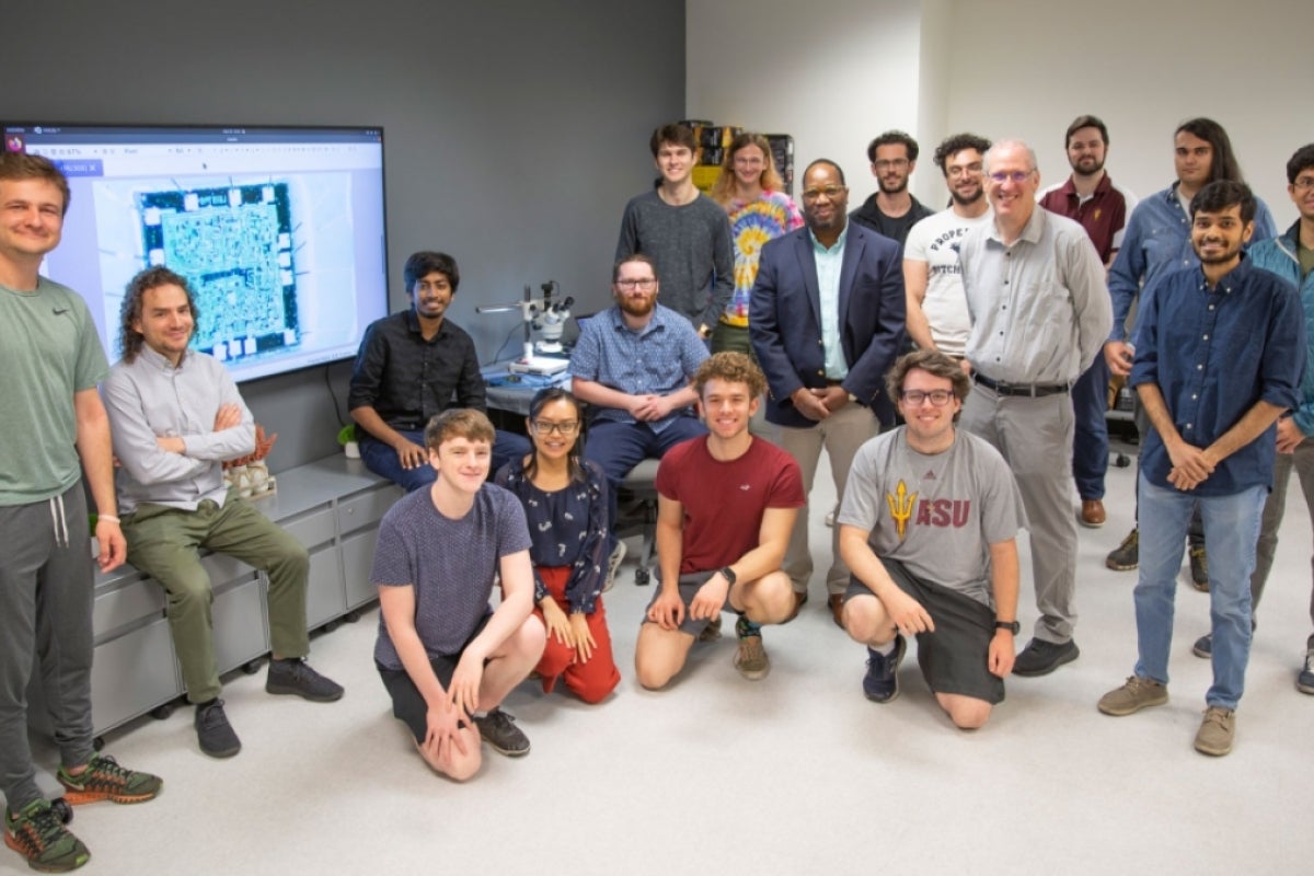 The spring 2022 STAM Center researchers pose for a group photo in a computer lab.