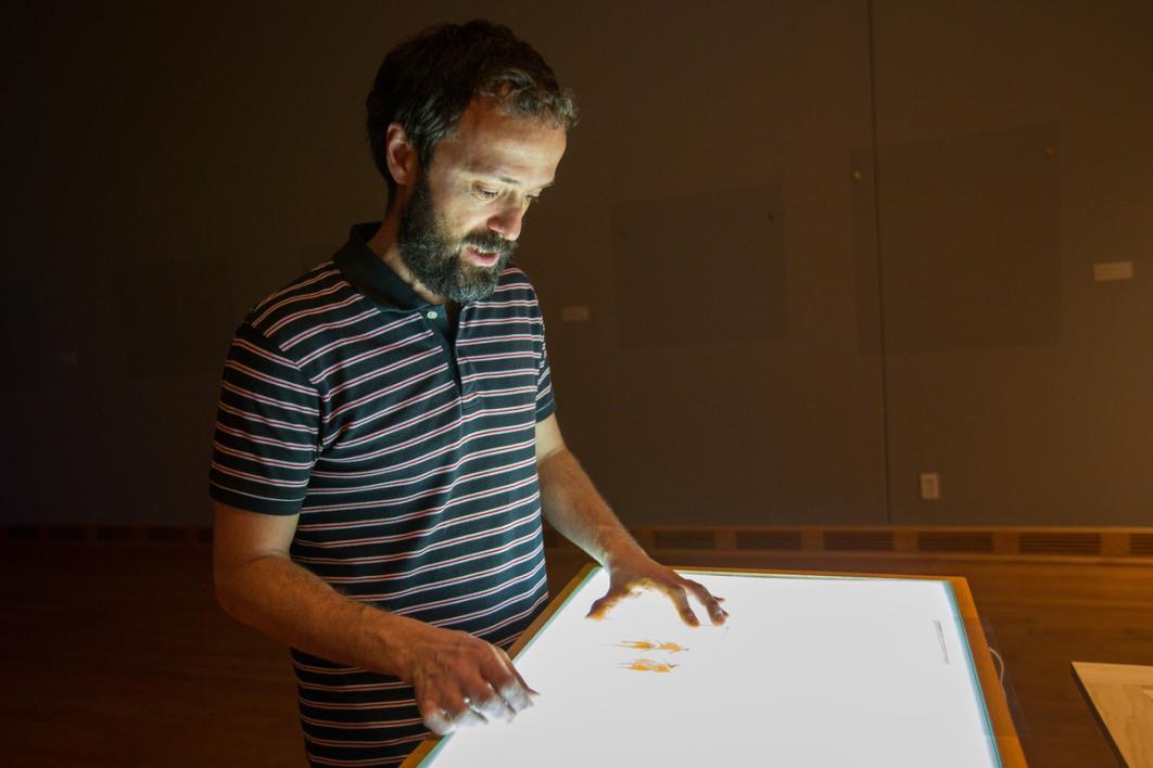 Man looking at things in a cool room.