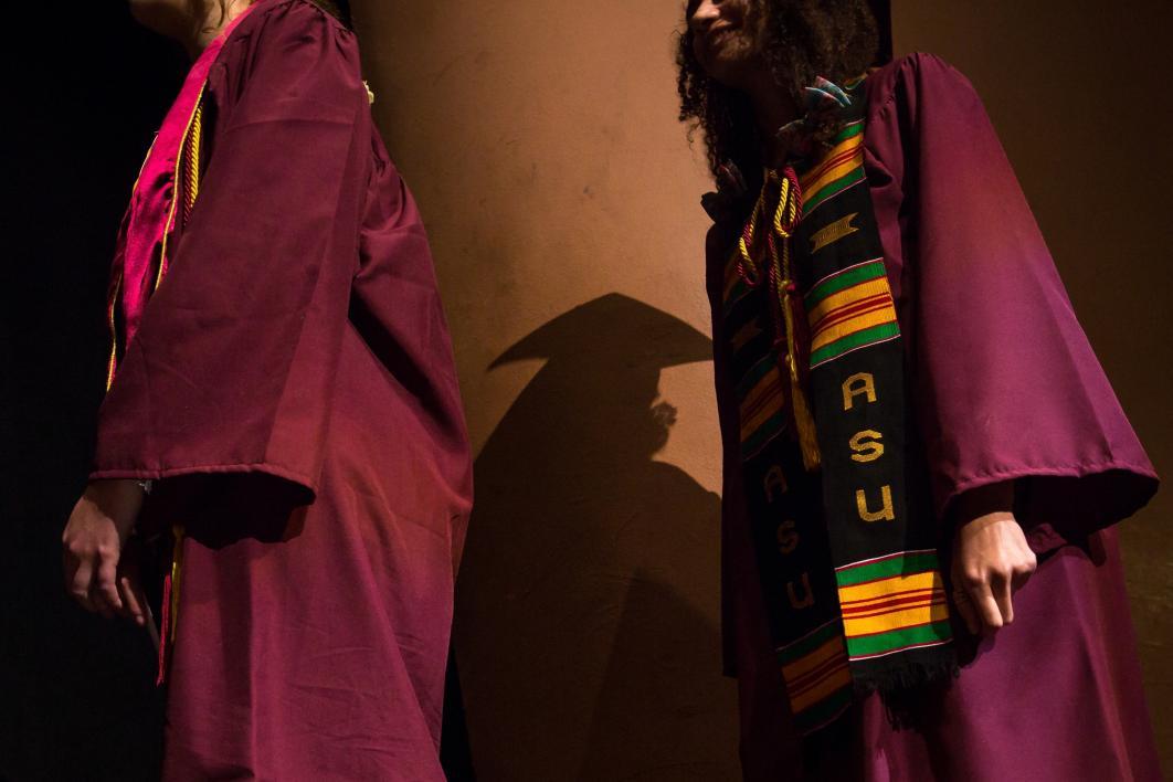 graduates lining up to receive diploma